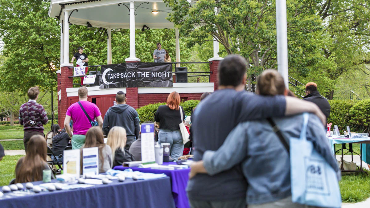 Lawrence community members take back the night, empower survivors of sexual violence photo
