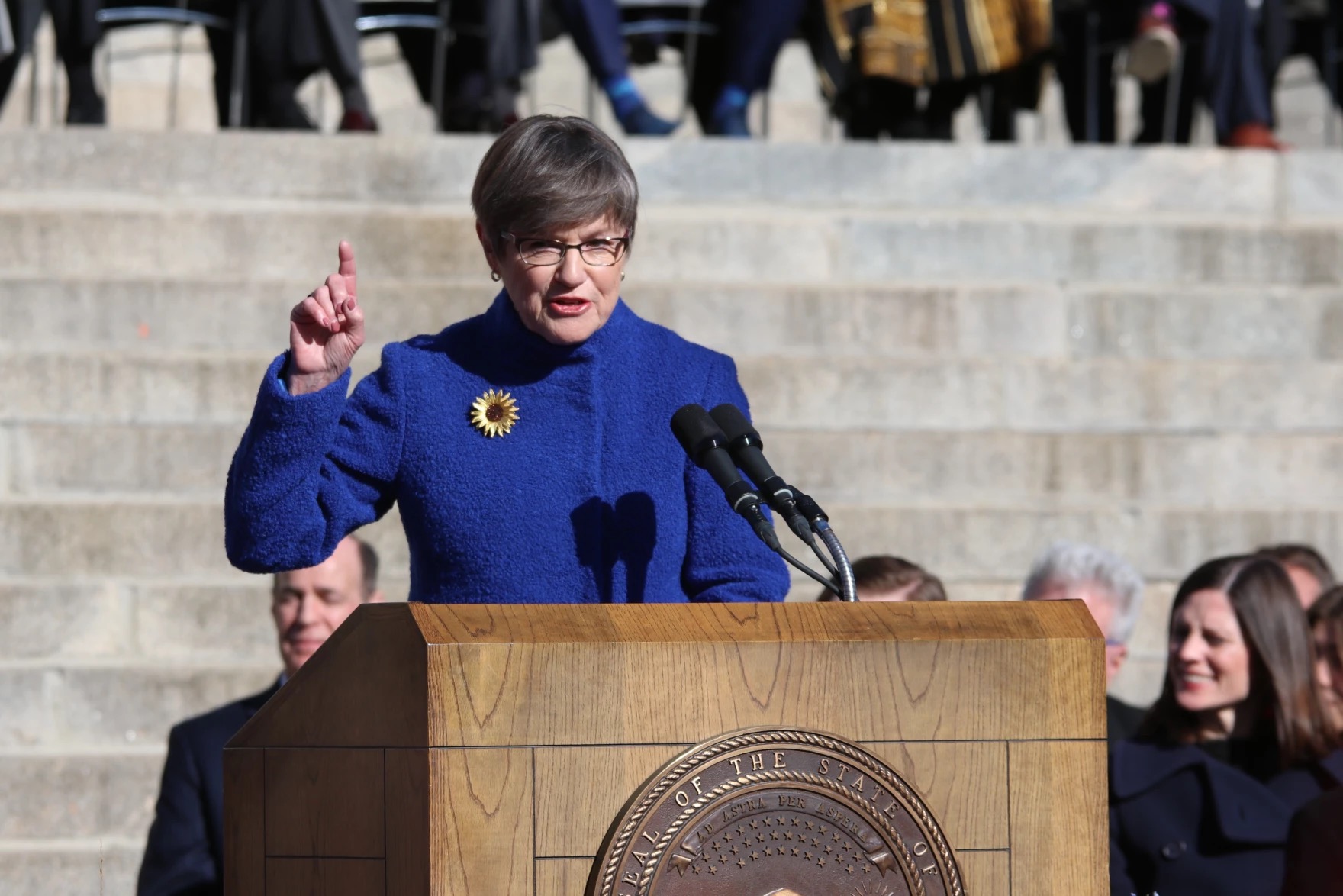 Kansans would see lower property, and sales taxes under the