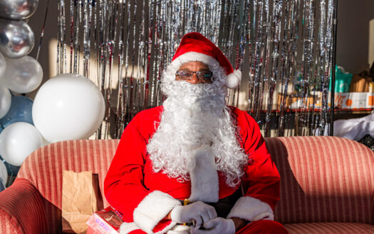 Santa Claus’ associates in Lawrence usher in holiday cheer