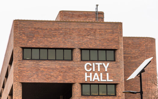 Man shot in Lawrence City Hall had no firearm, had asked to go to train station, law enforcement says