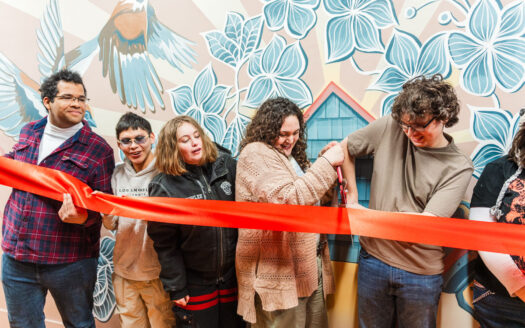Young artists of Van Go, community celebrate new mural at downtown Lawrence bridal shop