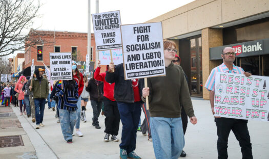 Lawrence community members, area activists rally and march for trans rights